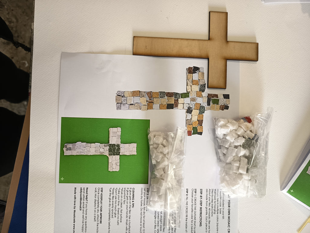 DIY mosaic cross kit - here you can see exactly what you will receive: wooden cross base, hand-cut marble tiles, center tile in your chosen color, glue, wall hook and printed instructions