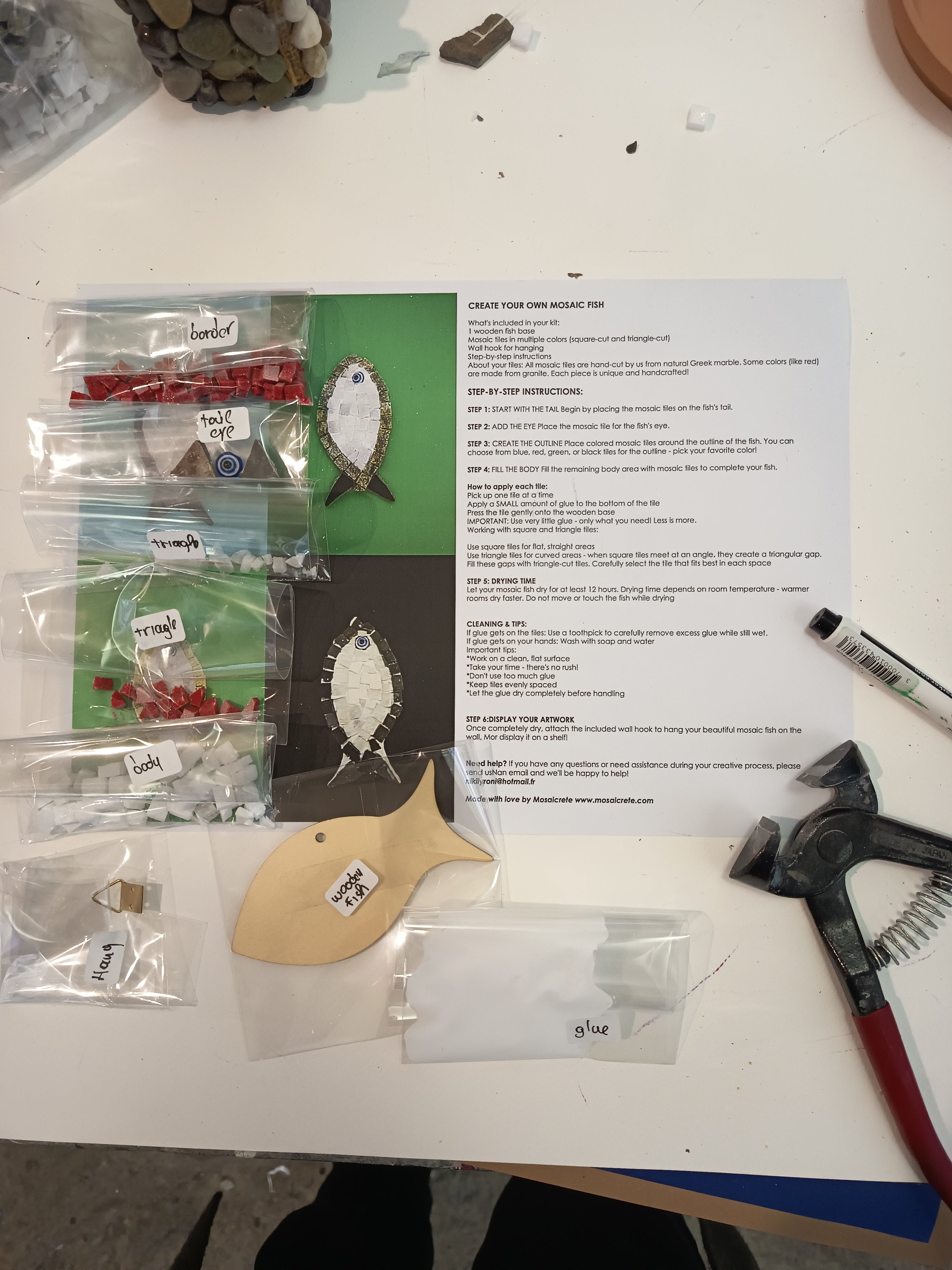Complete DIY mosaic fish kit showing finished product, wooden fish base, hand-cut tiles and materials
