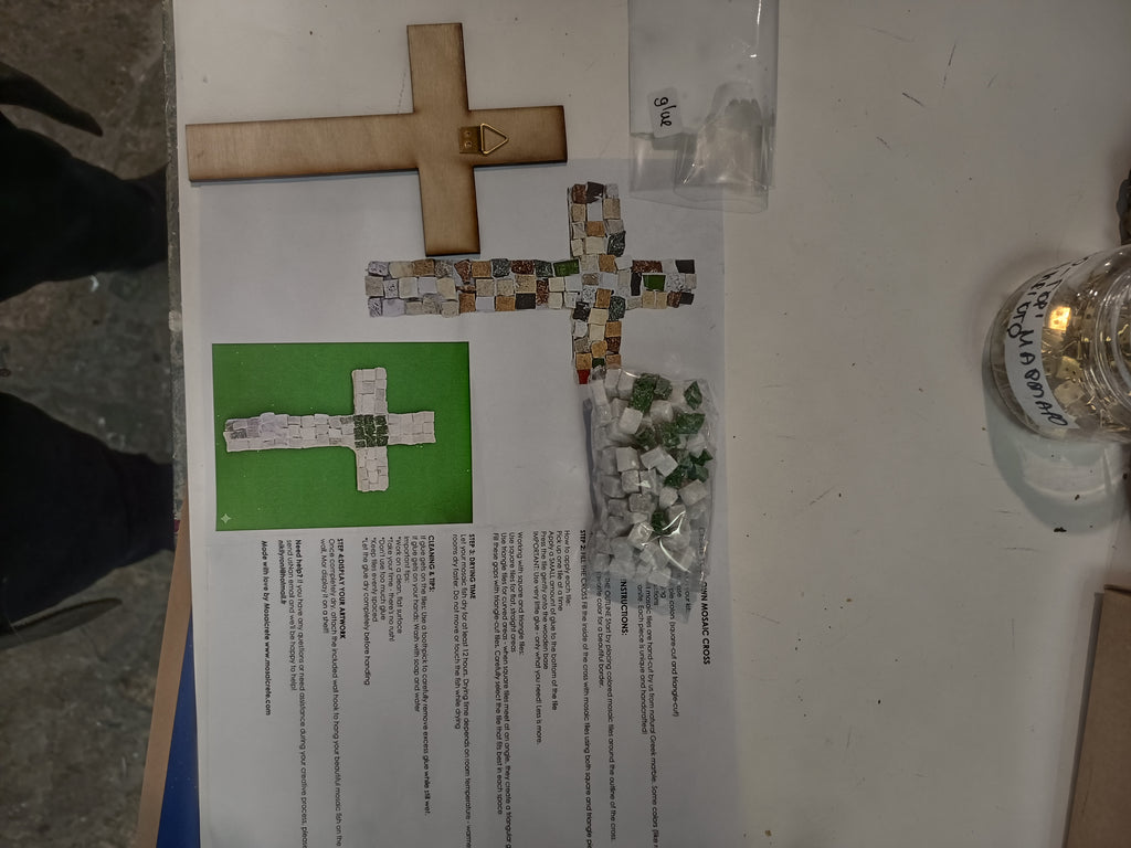 DIY mosaic cross kit - here you can see exactly what you will receive: wooden cross base, hand-cut marble tiles, center tile in your chosen color, glue, wall hook and printed instructions